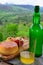 Natural Asturian cider made fromÂ fermented apples and Asturian cow smoked and view Picos de Europa mountains on background